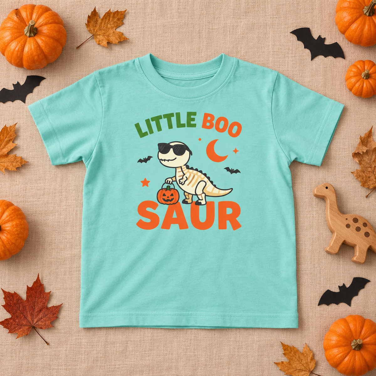 Little Boo-saur toddler T-shirt in Saltwater, Halloween dinosaur flatlay