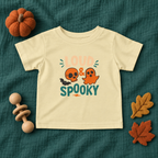 Loud & Spooky infant T-shirt in Butter, styled Halloween flatlay